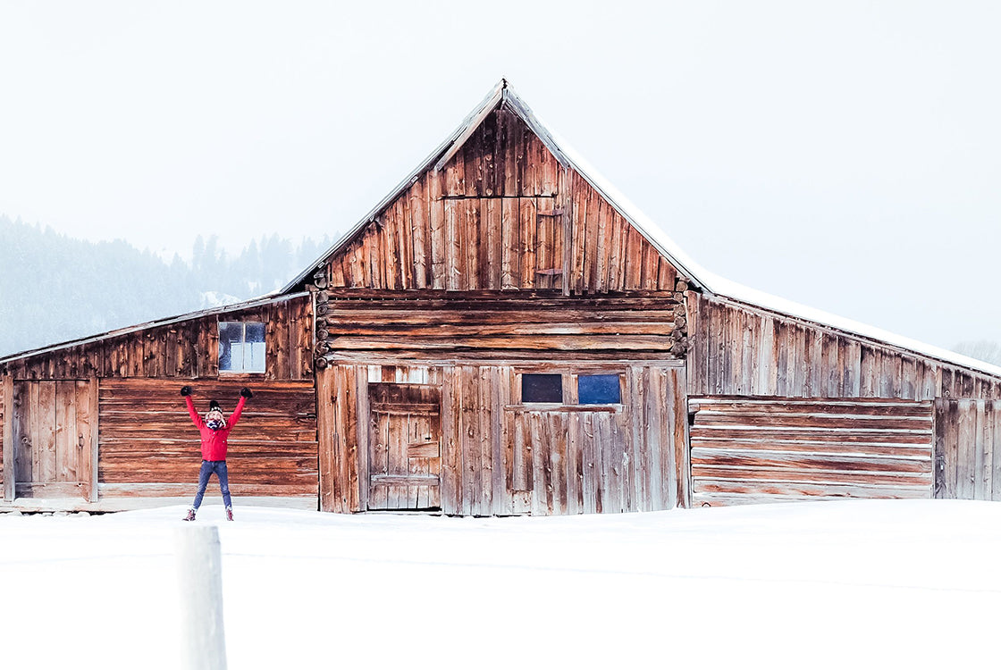 natural winter wellness tips image of barn in winter with snow